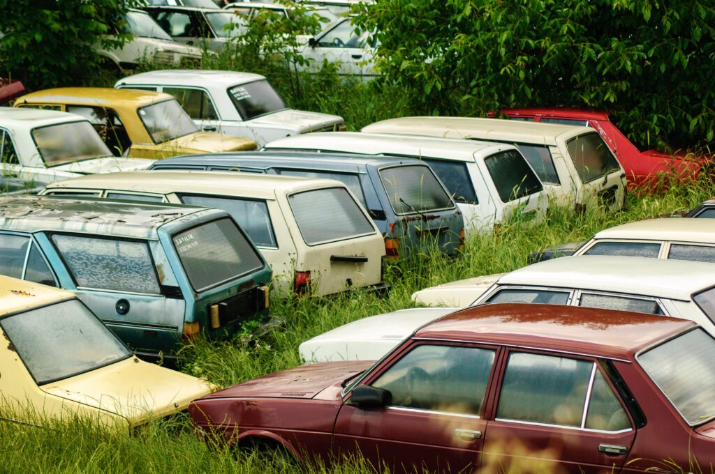 A collection of abandoned vintage cars parked in rural Tavas, Denizli, Türkiye.